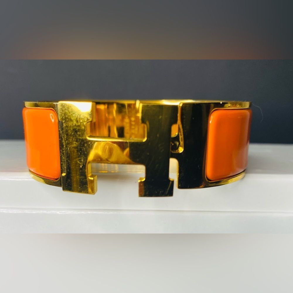 HERMES Signature Orange Enamel and Gold Plated Clic-Clac H GM Wide Bracelet